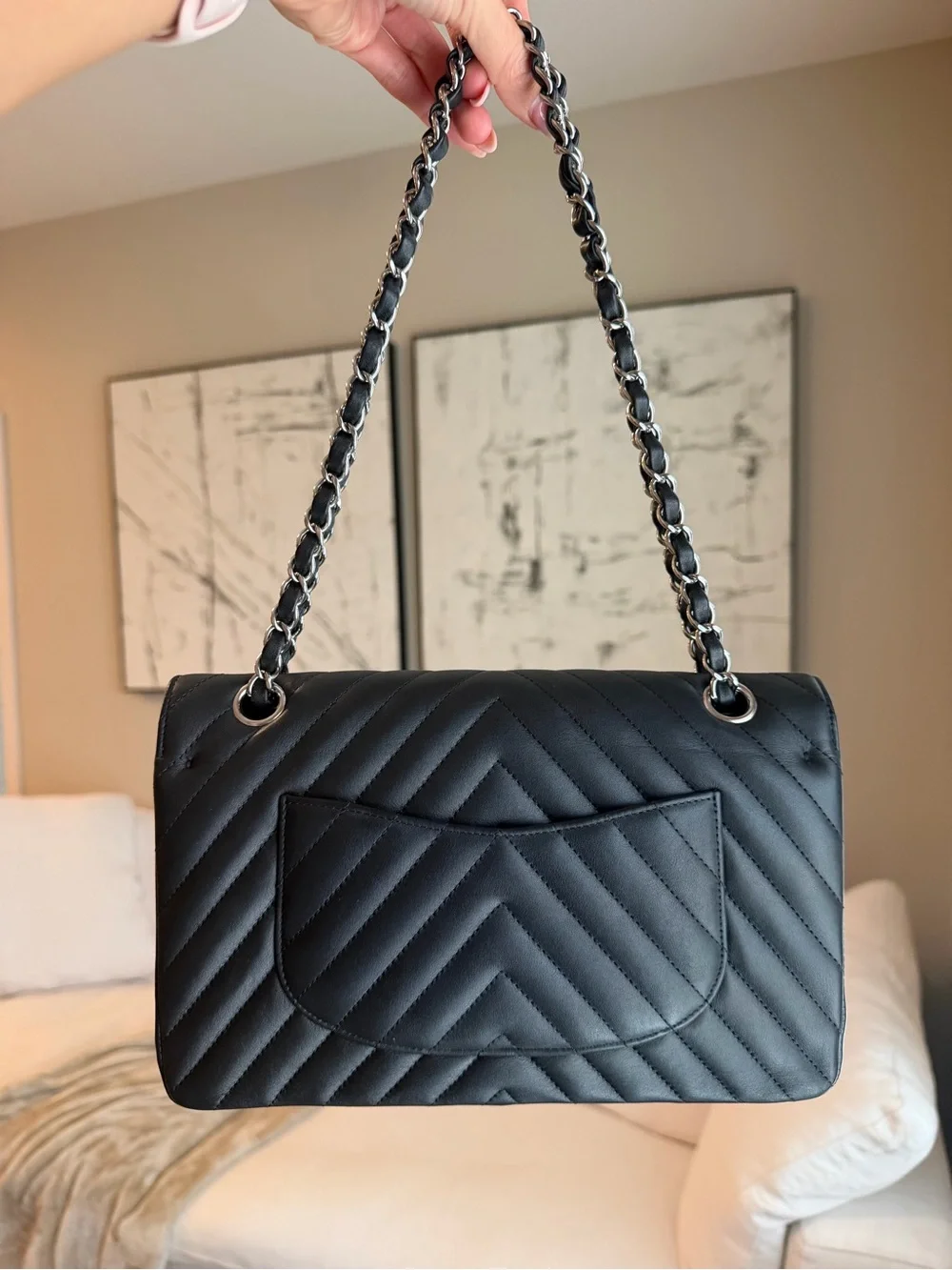 CHANEL Black Leather Interior with Silver Logo Plaque